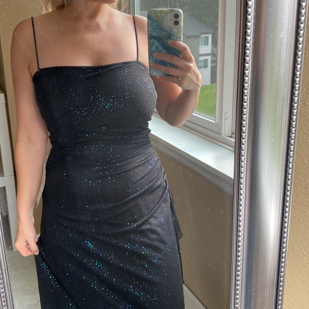 Iridescent evening gown with ruffles and rouching